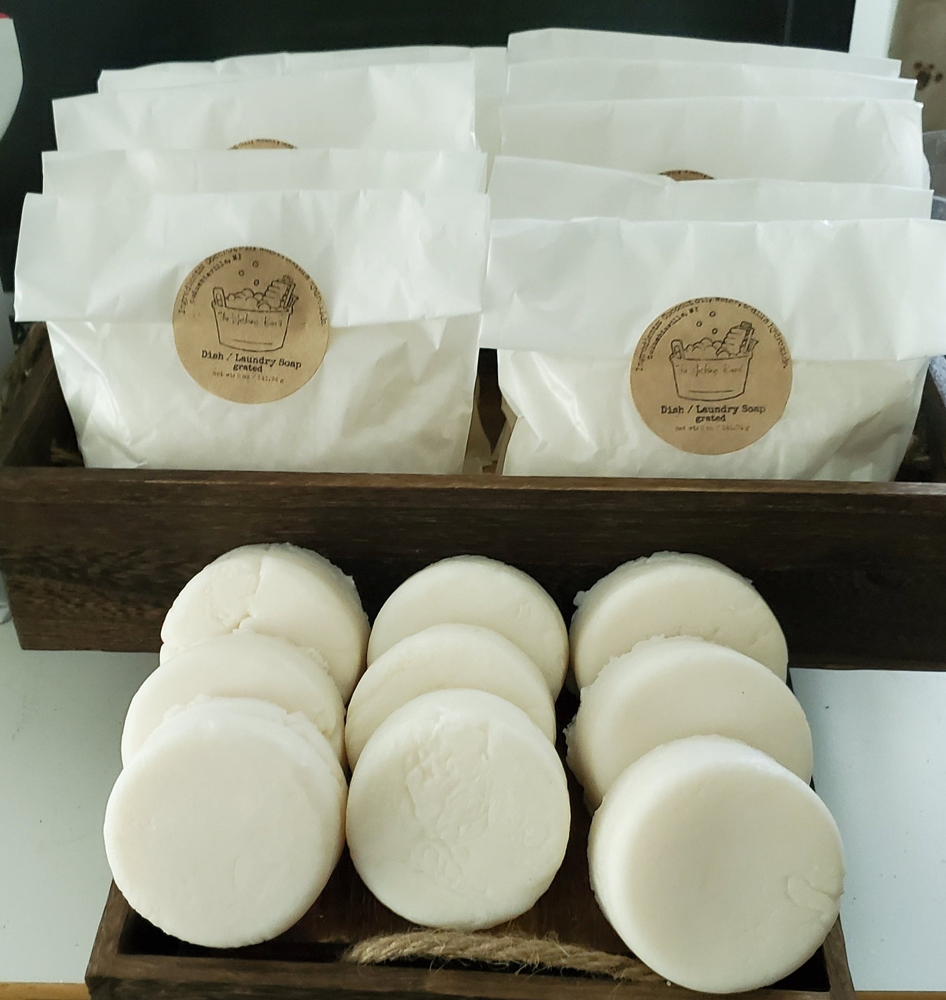 Dish and Laundry soap, "naked;" pucks shown in front,  bags of ground shown in back.