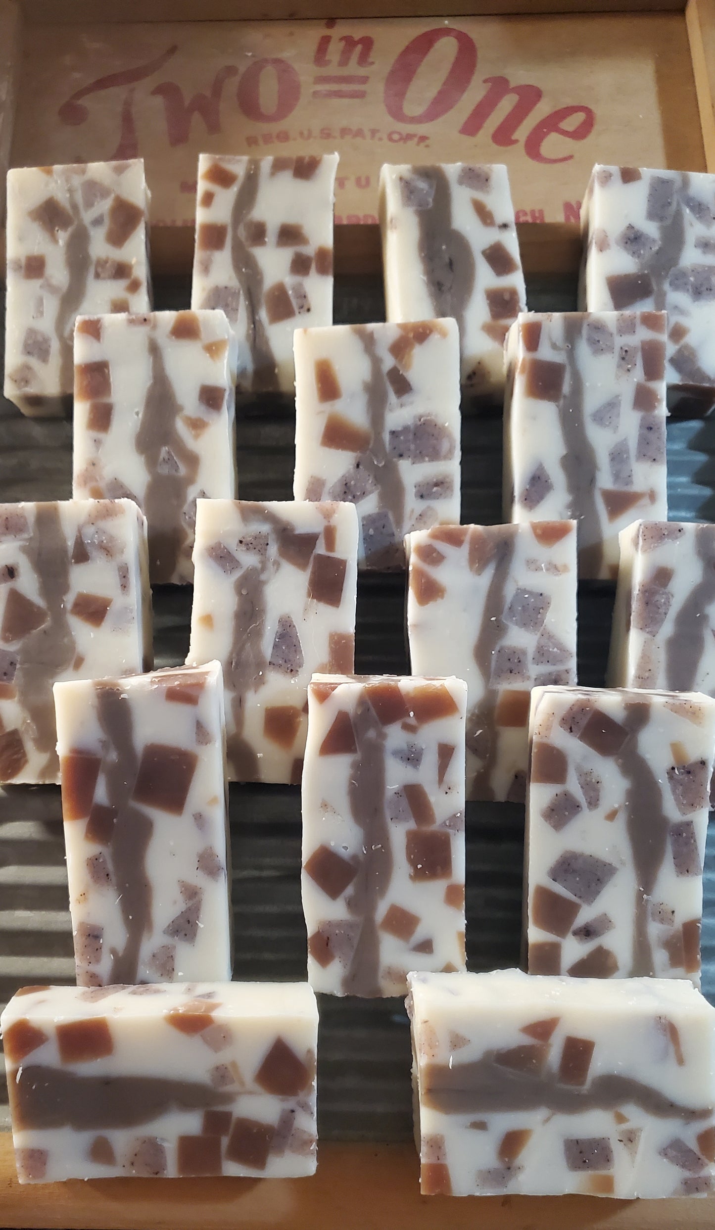 Calico All in One shampoo and body soap shown displayed on a washing board.