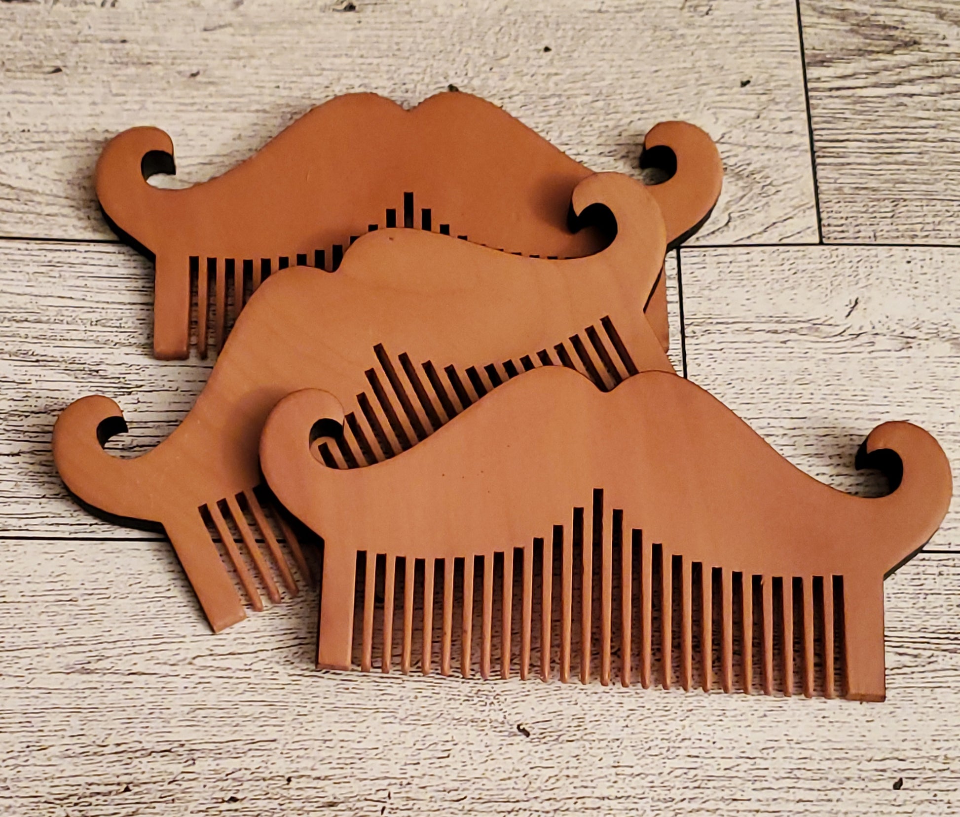 3 Mustache Combs displayed together