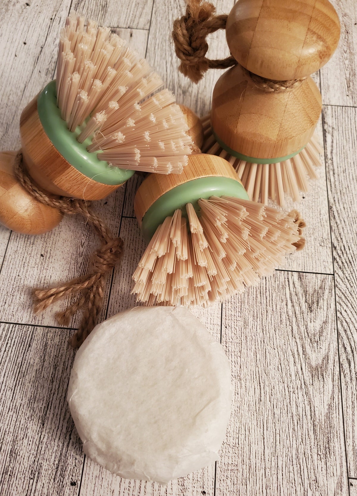 3 Scrubby Dish Brushes shown together with a Dish and Laundry puck. 
