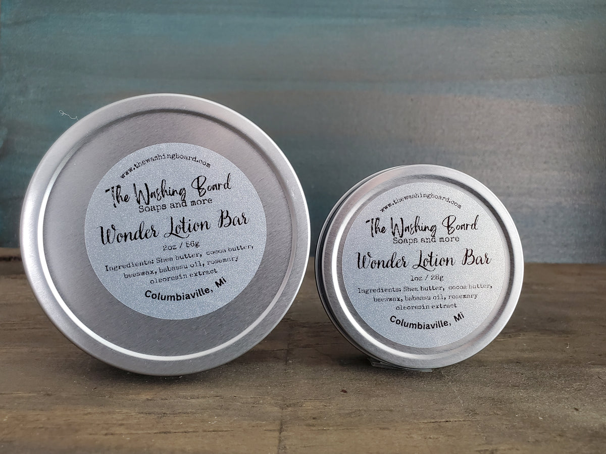 Unscented solid lotion bar in a tin from The Washing Board.