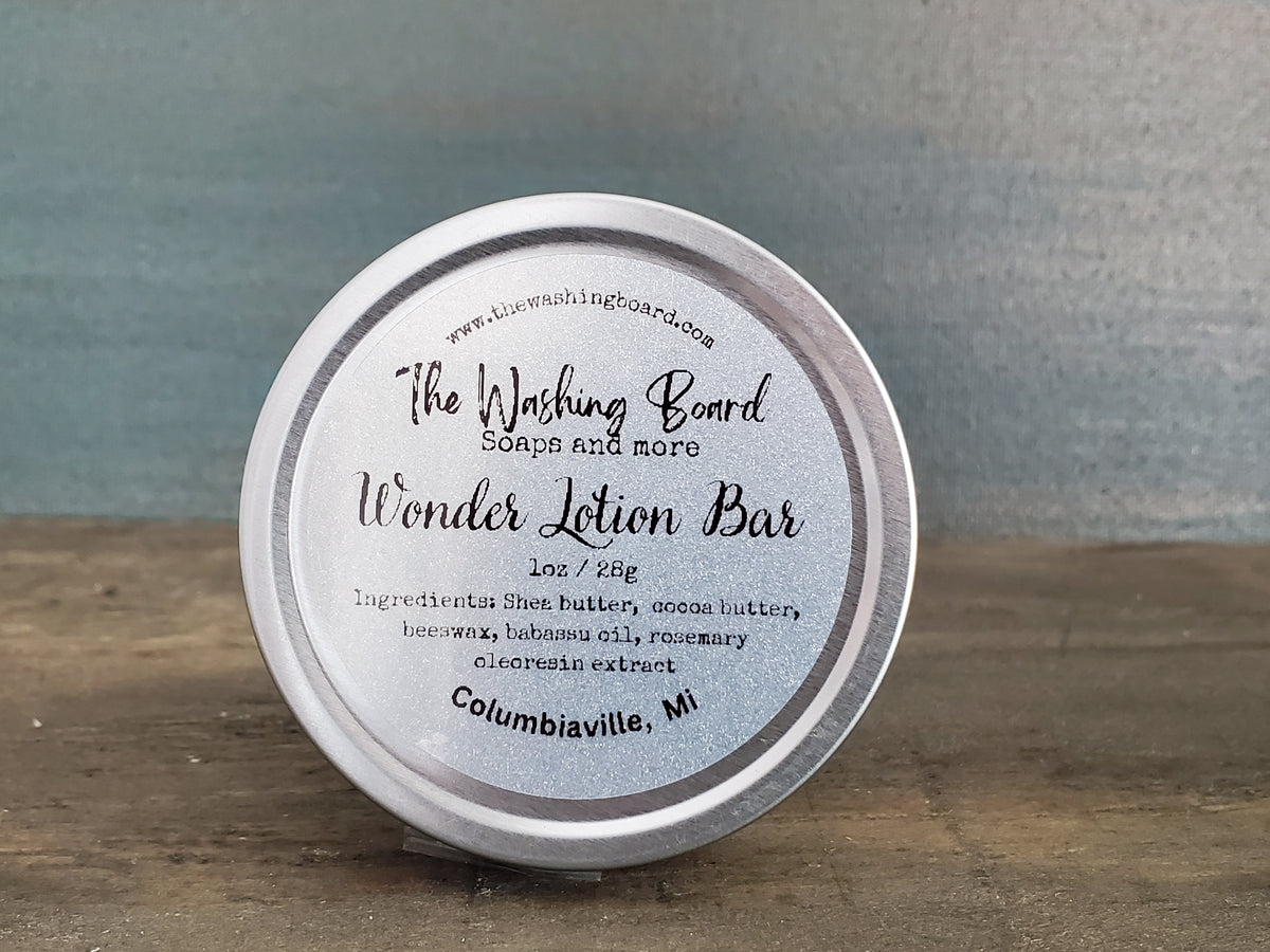 Unscented solid lotion bar in a tin from The Washing Board.