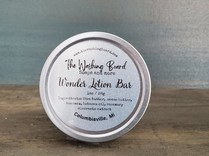 Unscented solid lotion bar in a tin from The Washing Board.