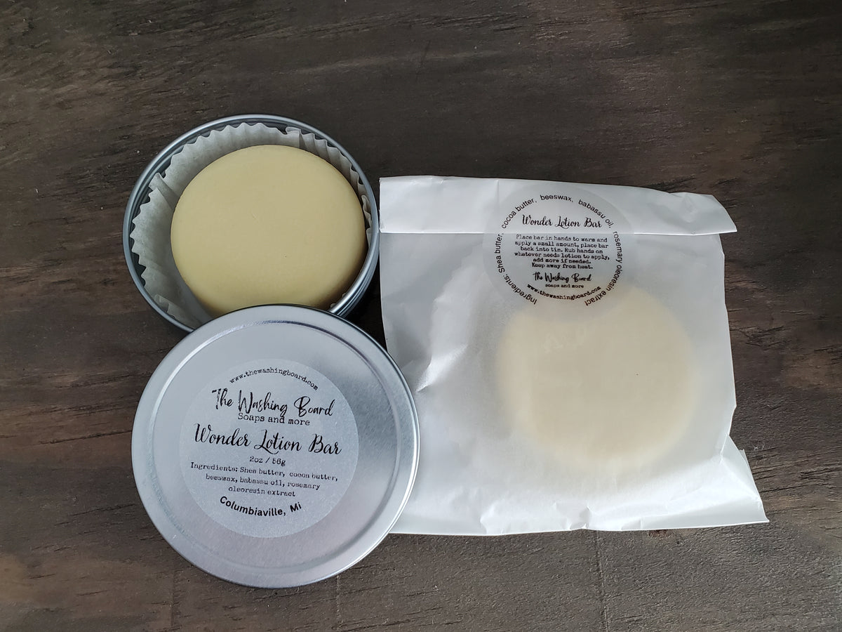 Unscented solid lotion bar in a tin from The Washing Board.
