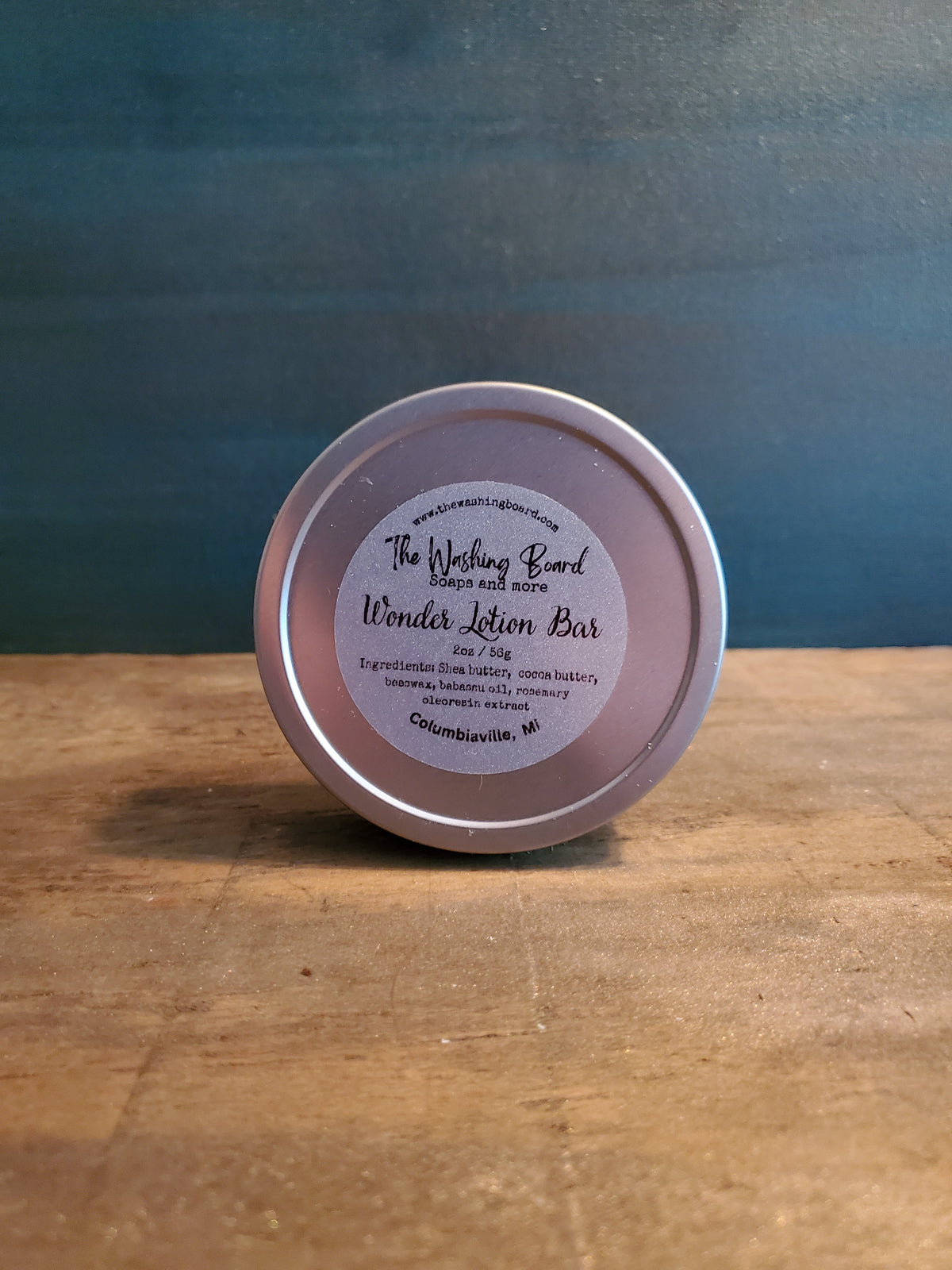 Unscented solid lotion bar in a tin from The Washing Board.