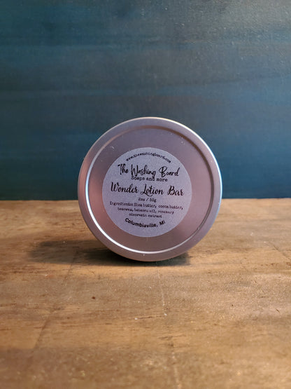Unscented solid lotion bar in a tin from The Washing Board.