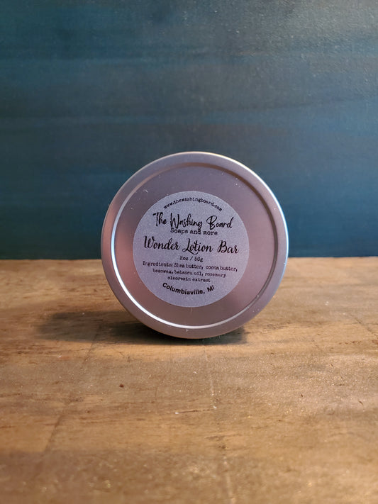 Unscented solid lotion bar in a tin from The Washing Board.