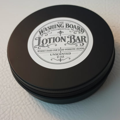 Unscented solid lotion bar in a tin from The Washing Board.