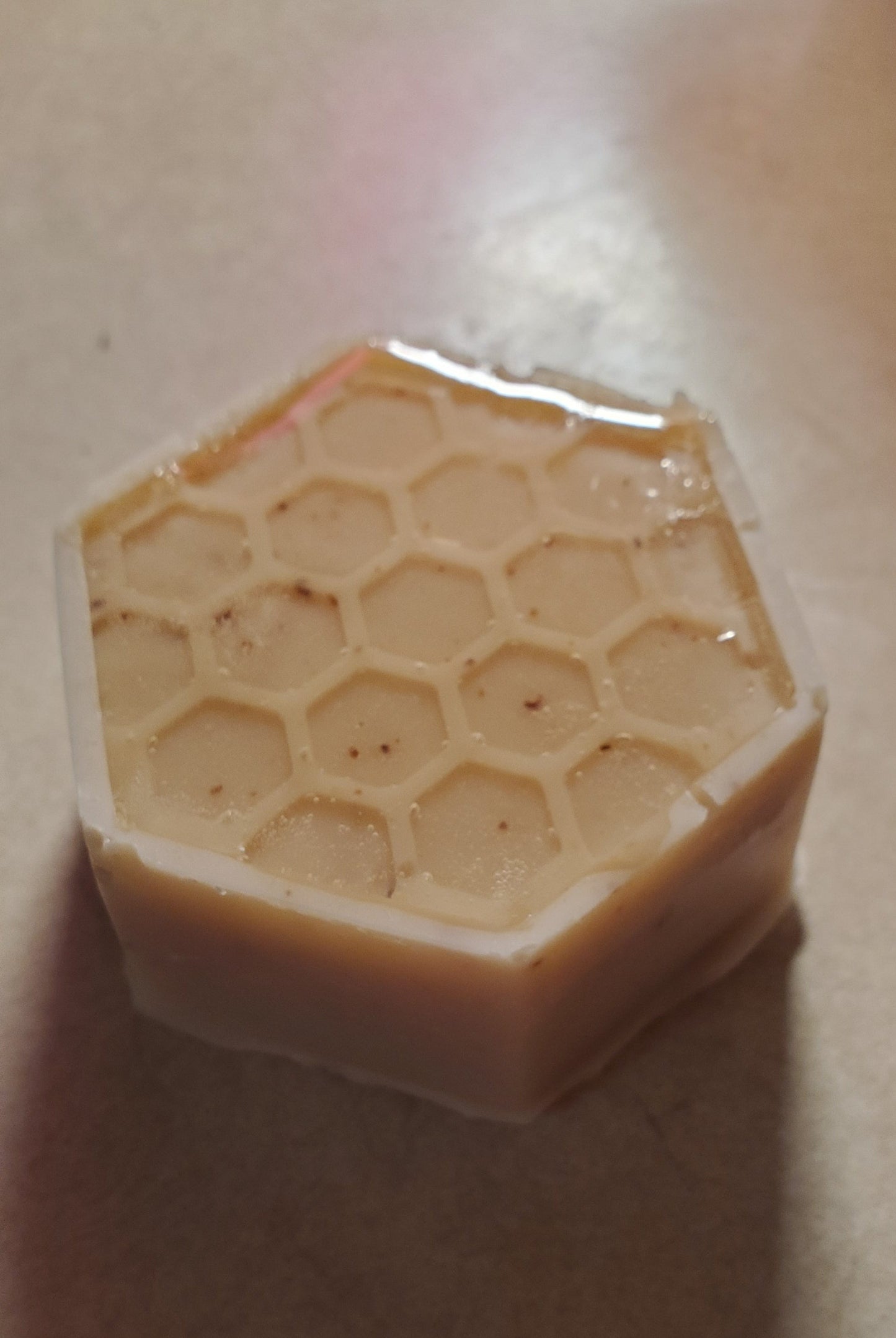 Bee Happy honeycomb edition shown with "honey" topped hexagon shape.