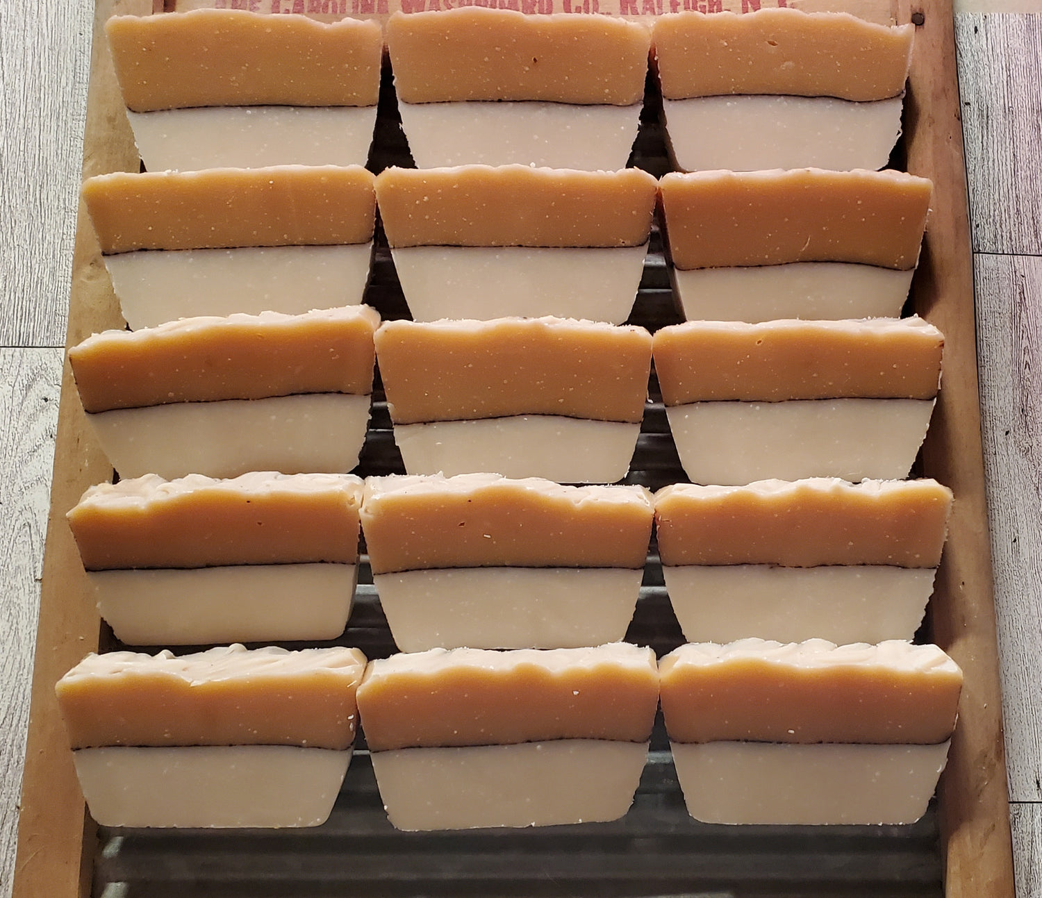 Butterific shea and honey soaps shown displayed on a washing board.
