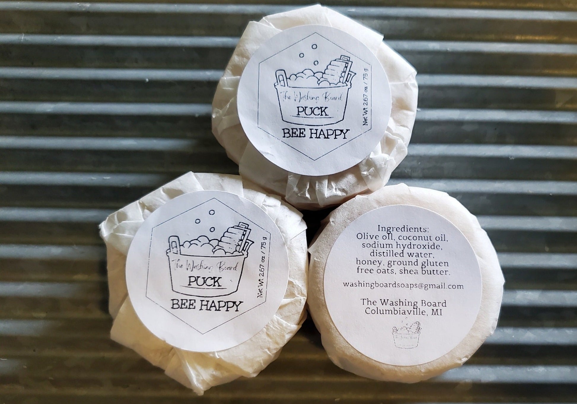 Bee Happy puck shown with label and ingredient label