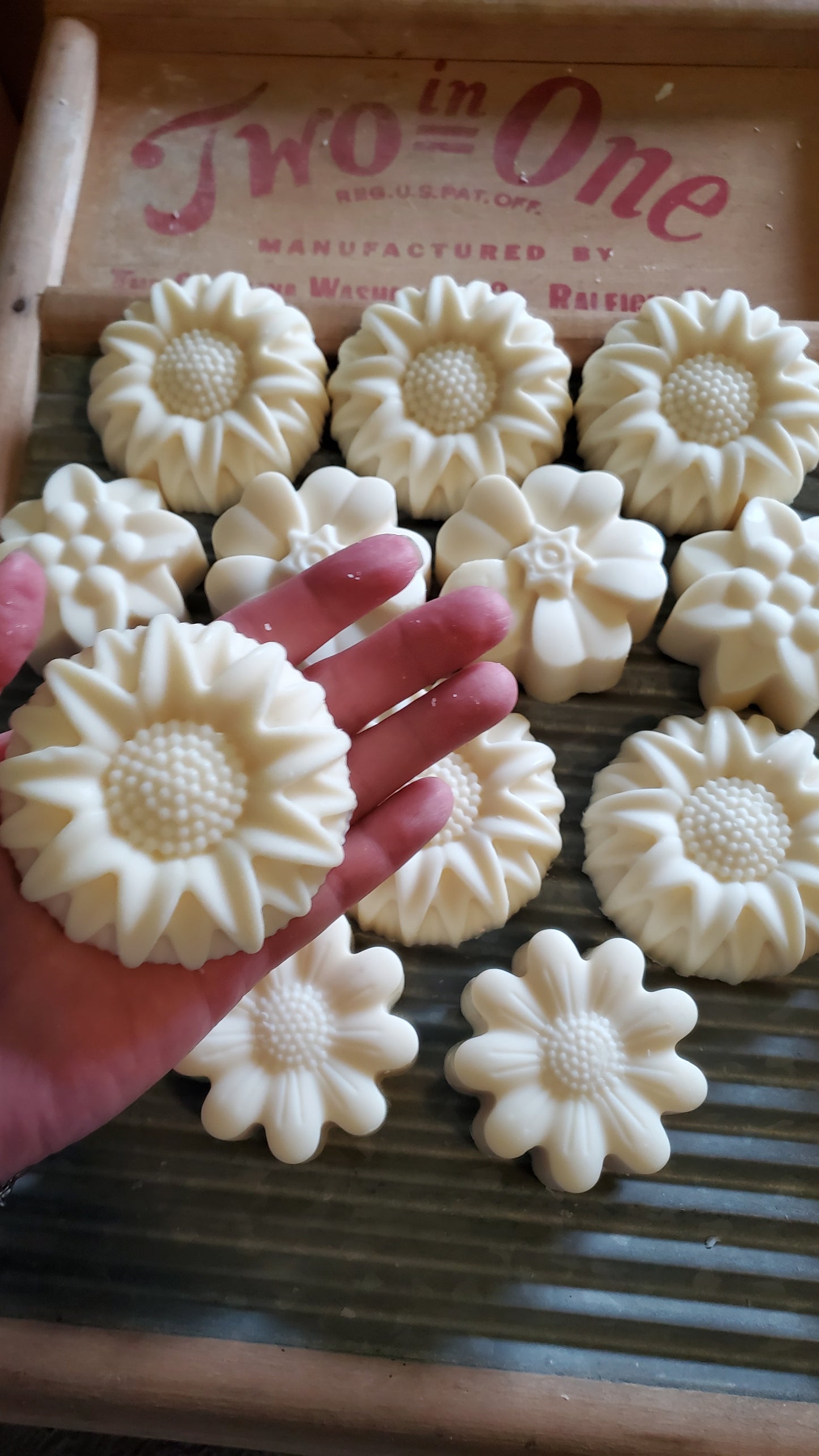 Just Plain floral edition soap shown in a woman's hand. 