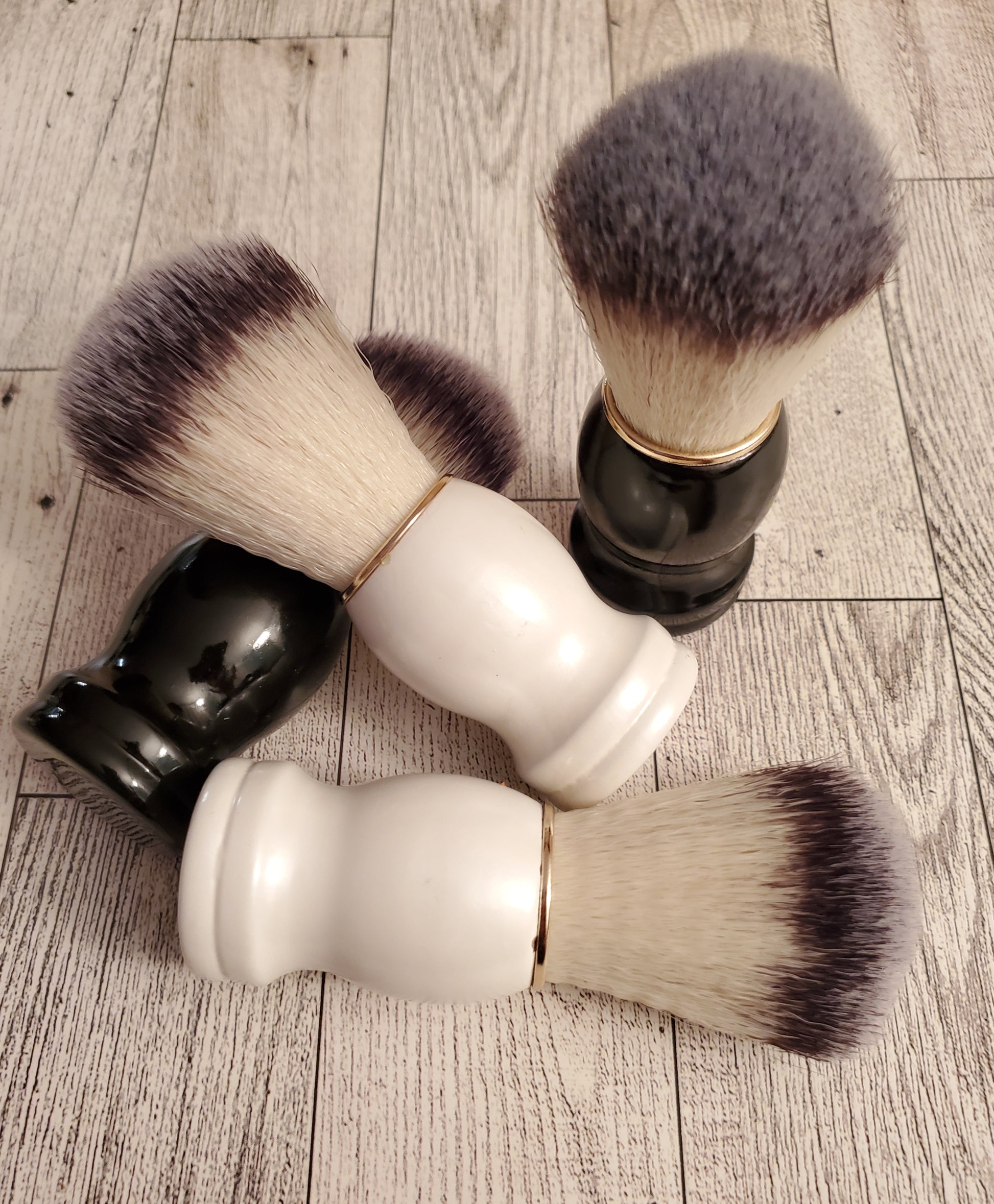 Shave Brush,  black and white handle together. 